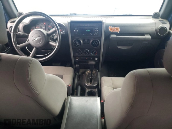 2009 Jeep Wrangler X with VIN 1J4FA24109L712701, listed as a Copart auction lot 60800855 with 156,709 mi miles and Salvage title. Bid and sale history available at DreamBid. Image 8.