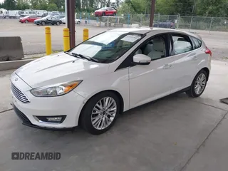 2018 Ford Focus Titanium z VIN 1FADP3N27JL314856, wystawiony jako IAAI lot #42553390 z przebiegiem 82 936 mil mil oraz . Historia ofert i sprzedaży dostępna na DreamBid. Obrazek 17.