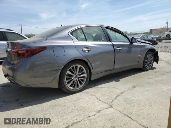 2019 Infiniti Q50 Luxe with VIN JN1EV7AR4KM558896, listed as a Copart auction lot 54249545 with 96,696 mi miles and Salvage title. Bid and sale history available at DreamBid. Image 3.