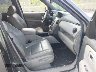 2011 Honda Pilot Touring with VIN 5FNYF4H90BB103824, listed as a IAAI auction lot 42127137 with 243,858 mi miles and . Bid and sale history available at carsss.com. Image 5.