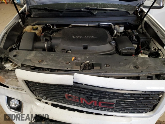 2018 GMC Canyon 4WD Denali z VIN 1GTG6EEN6J1171037, wystawiony jako Copart lot #52521865 z przebiegiem 99 931 mil mil oraz Szkoda całkowita • Salvage title. Historia ofert i sprzedaży dostępna na DreamBid. Obrazek 11.