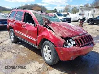 2010 Jeep Grand Cherokee Laredo with VIN 1J4PR4GK9AC143199, listed as a IAAI auction lot 41972153 with 81,896 mi miles. Bid and sale history available at carsss.com. Image 1.