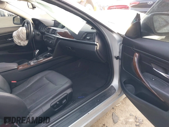 2015 BMW 4 Series 428i xDrive with VIN WBA3N9C53FK247985, listed as a IAAI auction lot 41395534 with 76,856 mi miles and . Bid and sale history available at DreamBid. Image 5.