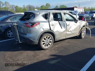2013 Mazda CX-5 Grand Touring with VIN JM3KE2DEXD0130585, listed as a IAAI auction lot 42001388 with 66,348 mi miles. Bid and sale history available at carsss.com. Image 4.