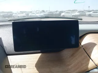 2015 BMW i3 z VIN WBY1Z2C51FV286397, wystawiony jako IAAI lot #41729019 z przebiegiem Nie podano mil oraz . Historia ofert i sprzedaży dostępna na DreamBid. Obrazek 14.