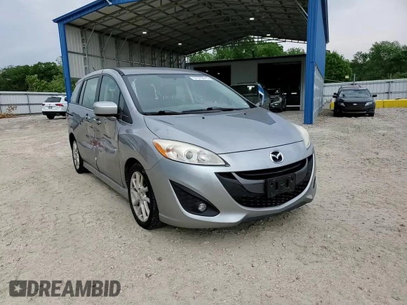 2012 Mazda 5 Touring z VIN JM1CW2CL6C0143536, wystawiony jako Copart lot #57579915 z przebiegiem 148 191 mil mil oraz Szkoda całkowita • Salvage title. Historia ofert i sprzedaży dostępna na DreamBid. Obrazek 14.