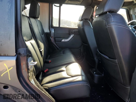 2014 Jeep Wrangler Unlimited Rubicon with VIN 1C4BJWFG4EL256824, listed as a Copart auction lot 49473815 with 117,264 mi miles and Salvage Title. Bid and sale history available at carsss.com. Image 10.