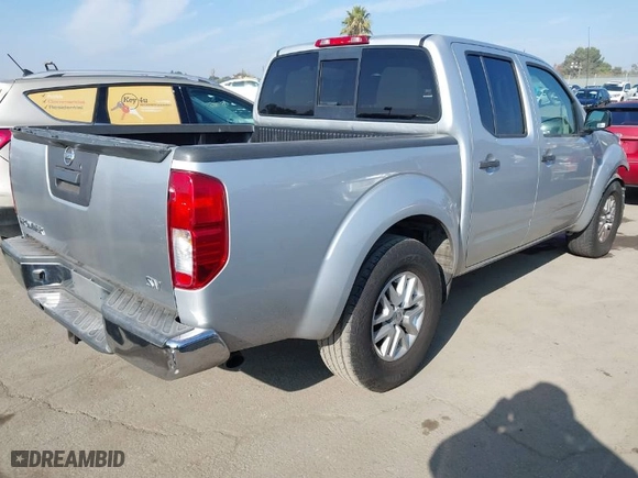 2014 Nissan Frontier SV with VIN 1N6AD0ER1EN720642, listed as a IAAI auction lot 41006979 with 157,477 mi miles. Bid and sale history available at carsss.com. Image 4.