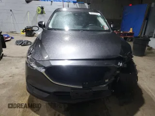 2017 Mazda CX-5 Touring with VIN JM3KFBCL9H0202976, listed as a Copart auction lot 88595355 with 68,066 mi miles and Salvage Title. Bid and sale history available at carsss.com. Image 5.