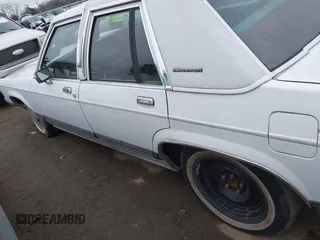 1991 Mercury Grand Marquis z VIN 2MECM75F2MX678620, wystawiony jako IAAI lot #41545796 z przebiegiem 52 567 mil mil oraz . Historia ofert i sprzedaży dostępna na DreamBid. Obrazek 14.