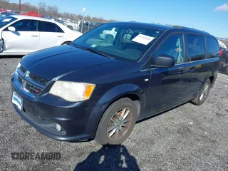 2014 Dodge Grand Caravan SXT with VIN 2C4RDGCG3ER339491, listed as a IAAI auction lot 41744826 with 146,757 mi miles and . Bid and sale history available at DreamBid. Image 2.