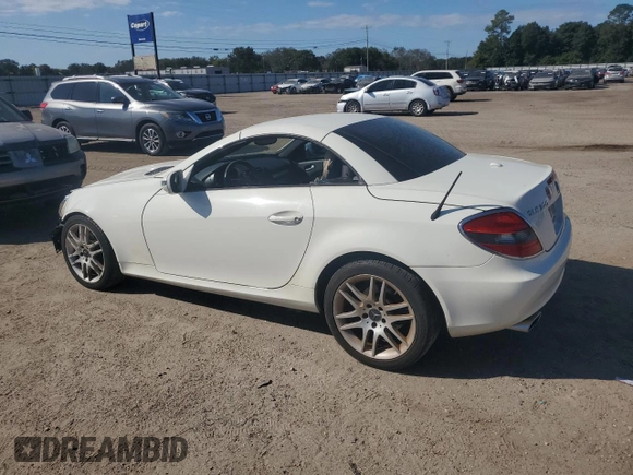 2009 Mercedes-Benz SLK-Class 3.0L with VIN WDBWK54F79F209339, listed as a Copart auction lot 77400294 with 68,540 mi miles and Salvage Title. Bid and sale history available at carsss.com. Image 2.