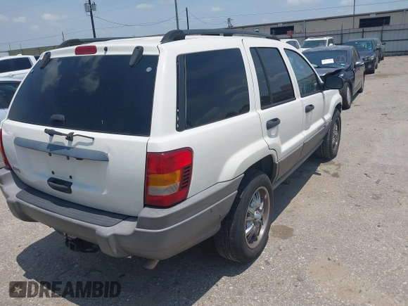 2003 Jeep Grand Cherokee Laredo with VIN 1J4GX48S63C546208, listed as a IAAI auction lot 42288811 with 141,696 mi miles and . Bid and sale history available at DreamBid. Image 4.