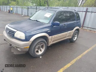 2001 Suzuki Grand Vitara JLX z VIN JS3TD62VX14165885, wystawiony jako IAAI lot #42091059 z przebiegiem 197 030 mil mil oraz . Historia ofert i sprzedaży dostępna na DreamBid. Obrazek 2.