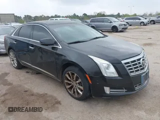 2015 Cadillac XTS Luxury z VIN 2G61M5S39F9136948, wystawiony jako IAAI lot #41799471 z przebiegiem 184 124 mil mil oraz . Historia ofert i sprzedaży dostępna na DreamBid. Obrazek 1.