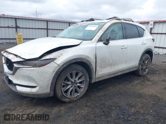 2019 Mazda CX-5 Grand Touring with VIN JM3KFBDM9K0697467, listed as a IAAI auction lot 41940364 with 62,015 mi miles. Bid and sale history available at carsss.com. Image 2.