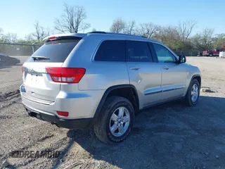 2013 Jeep Grand Cherokee Laredo with VIN 1C4RJFAG3DC586667, listed as a IAAI auction lot 42041524 with 100,635 mi miles. Bid and sale history available at carsss.com. Image 4.