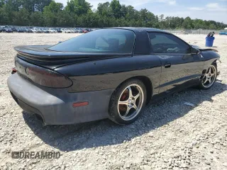 1999 Pontiac Firebird Formula z VIN 2G2FV22G4X2233748, wystawiony jako Copart lot #55693535 z przebiegiem 166 622 mil mil oraz Szkoda całkowita • Salvage title. Historia ofert i sprzedaży dostępna na DreamBid. Obrazek 3.