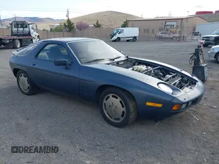 1982 Porsche 928 z VIN WP0JA0926CS821506, wystawiony jako IAAI lot #41903954 z przebiegiem 64 814 mil mil oraz . Historia ofert i sprzedaży dostępna na DreamBid. Obrazek 1.