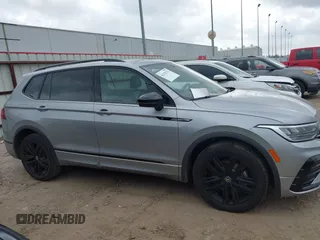 2022 Volkswagen Tiguan SE R-Line Black with VIN 3VVCB7AXXNM165748, listed as a IAAI auction lot 42178772 with 64,007 mi miles and . Bid and sale history available at DreamBid. Image 13.