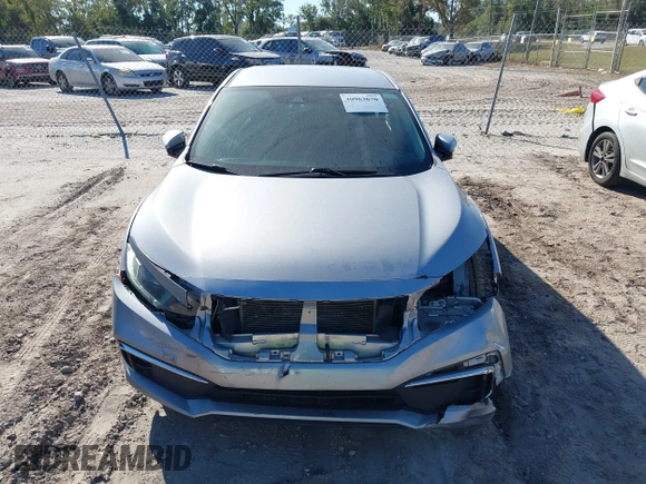 2020 Honda Civic LX with VIN 19XFC2F62LE009433, listed as a IAAI auction lot 40963670 with 117,865 mi miles and . Bid and sale history available at DreamBid. Image 12.