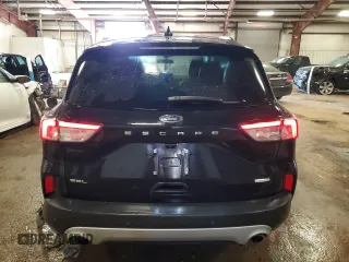 2020 Ford Escape SEL with VIN 1FMCU0H61LUA31728, listed as a Copart auction lot 54824065 with 63,194 mi miles and Salvage title. Bid and sale history available at DreamBid. Image 6.