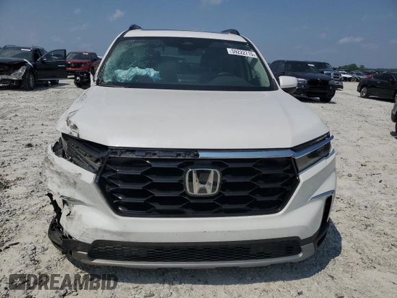 2023 Honda Pilot Touring with VIN 5FNYG2H77PB014212, listed as a Copart auction lot 59222715 with 4,507 mi miles and Salvage title. Bid and sale history available at DreamBid. Image 5.