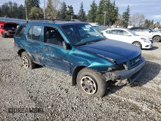 1999 Isuzu Rodeo S with VIN 4S2CM58W7X4359649, listed as a Copart auction lot 83450174 with 171,940 mi miles and Salvage title. Bid and sale history available at DreamBid. Image 4.