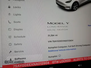 2022 Tesla Model Y Long Range z VIN 7SAYGDEEXNA012904, wystawiony jako Copart lot #57492865 z przebiegiem 31 294 mil mil oraz Szkody całkowita. Historia ofert i sprzedaży dostępna na DreamBid. Obrazek 9.