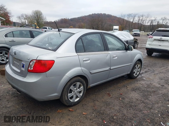 2010 Kia Rio LX with VIN KNADH4A37A6645279, listed as a IAAI auction lot 40856780 with 165,385 mi miles. Bid and sale history available at carsss.com. Image 4.