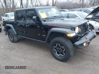 2023 Jeep Gladiator Rubicon z VIN 1C6JJTBGXPL510322, wystawiony jako IAAI lot #41151837 z przebiegiem 7 701 mil mil oraz . Historia ofert i sprzedaży dostępna na DreamBid. Obrazek 1.