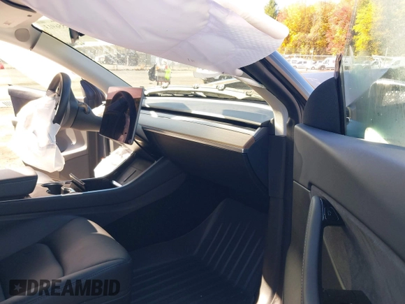 2020 Tesla Model Y Long Range with VIN 5YJYGDEE0LF041762, listed as a IAAI auction lot 40556913 with Not Provided miles and . Bid and sale history available at DreamBid. Image 5.