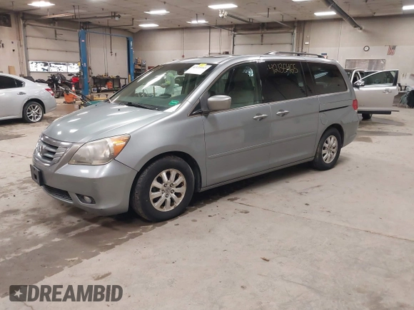2009 Honda Odyssey EX-L with VIN 5FNRL38789B015524, listed as a IAAI auction lot 42135465 with 242,005 mi miles. Bid and sale history available at carsss.com. Image 2.