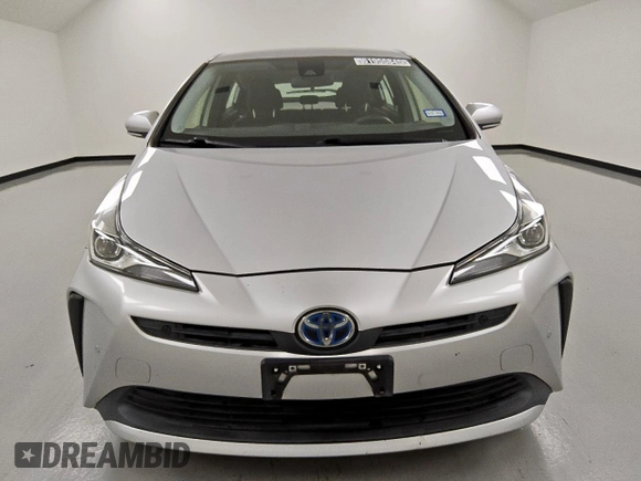 2021 Toyota Prius L Eco z VIN JTDKAMFU0M3140335, wystawiony jako Copart lot #61955845 z przebiegiem 96 071 mil mil oraz Czysty tytuł • Clean title. Historia ofert i sprzedaży dostępna na DreamBid. Obrazek 5.