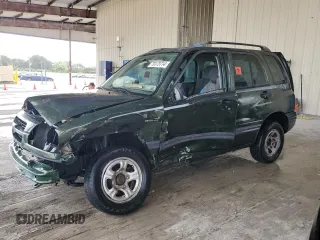 2000 Suzuki Vitara JLS z VIN 2S3TE52VXY6110157, wystawiony jako Copart lot #79173714 z przebiegiem 165 283 mil mil oraz Nie do naprawy. Historia ofert i sprzedaży dostępna na DreamBid. Obrazek 1.