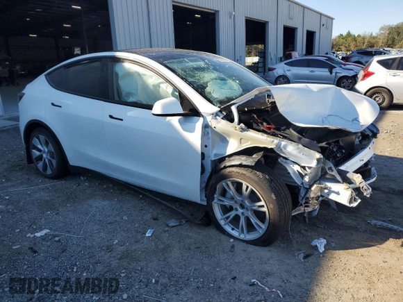 2023 Tesla Model Y Long Range z VIN 7SAYGAEE1PF810888, wystawiony jako Copart lot #88991735 z przebiegiem Nie podano mil oraz Nie do naprawy • Non repairable. Historia ofert i sprzedaży dostępna na DreamBid. Obrazek 4.