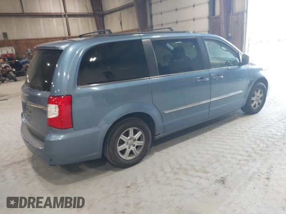 2011 Chrysler Town & Country Touring with VIN 2A4RR5DG4BR779844, listed as a IAAI auction lot 42167693 with 272,502 mi miles and . Bid and sale history available at DreamBid. Image 4.