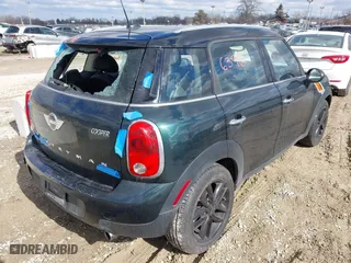 2013 MINI Cooper Countryman with VIN WMWZB3C58DWM09440, listed as a IAAI auction lot 41696396 with 52,930 mi miles. Bid and sale history available at carsss.com. Image 4.