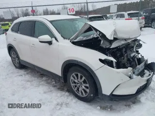 2016 Mazda CX-9 Touring with VIN JM3TCBCY4G0122329, listed as a IAAI auction lot 41453150 with 104,665 mi miles. Bid and sale history available at carsss.com. Image 1.