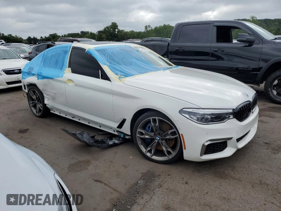 2018 BMW 5 Series M550i xDrive with VIN WBAJB9C5XJB035996, listed as a Copart auction lot 61459425 with Not provided miles and Salvage title. Bid and sale history available at DreamBid. Image 4.
