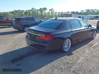 2015 BMW 7 Series 750Li with VIN WBAYE8C50FD781384, listed as a IAAI auction lot 42049829 with 128,087 mi miles. Bid and sale history available at carsss.com. Image 4.