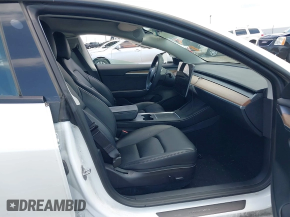 2023 Tesla Model 3 with VIN 5YJ3E1EA5PF407054, listed as a IAAI auction lot 42313770 with 57,621 mi miles and . Bid and sale history available at DreamBid. Image 5.
