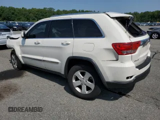 2011 Jeep Grand Cherokee Laredo with VIN 1J4RR4GG6BC657520, listed as a Copart auction lot 63558355 with 215,444 mi miles and Salvage title. Bid and sale history available at DreamBid. Image 2.