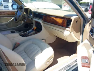 1996 Jaguar XJ with VIN SAJHX1740TC766425, listed as a IAAI auction lot 42758458 with 257,849 mi miles and . Bid and sale history available at DreamBid. Image 5.