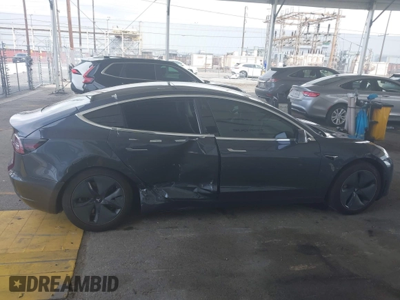 2020 Tesla Model 3 Standard Range Plus with VIN 5YJ3E1EA8LF743405, listed as a IAAI auction lot 41923592 with 81,901 mi miles. Bid and sale history available at carsss.com. Image 13.