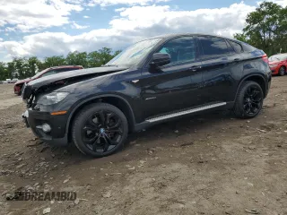 2012 BMW X6 50i z VIN 5UXFG8C51CLZ97393, wystawiony jako Copart lot #58407285 z przebiegiem 128 040 mil mil oraz Szkoda całkowita • Salvage title. Historia ofert i sprzedaży dostępna na DreamBid. Obrazek 1.