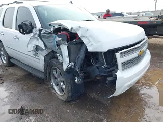 2009 Chevrolet Tahoe LTZ with VIN 1GNFK33079R293963, listed as a IAAI auction lot 41662695 with 185,408 mi miles and . Bid and sale history available at DreamBid. Image 6.