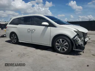 2017 Honda Odyssey Touring z VIN 5FNRL5H99HB007993, wystawiony jako Copart lot #60501805 z przebiegiem 104 628 mil mil oraz Szkoda całkowita • Salvage title. Historia ofert i sprzedaży dostępna na DreamBid. Obrazek 4.