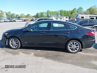 2019 Ford Fusion SEL with VIN 3FA6P0MU6KR252797, listed as a IAAI auction lot 41994504 with 106,029 mi miles and . Bid and sale history available at DreamBid. Image 14.