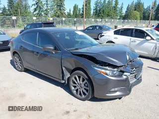 2018 Mazda 3 Touring z VIN JM1BN1V39J1158139, wystawiony jako IAAI lot #42374309 z przebiegiem 58 109 mil mil oraz . Historia ofert i sprzedaży dostępna na DreamBid. Obrazek 1.